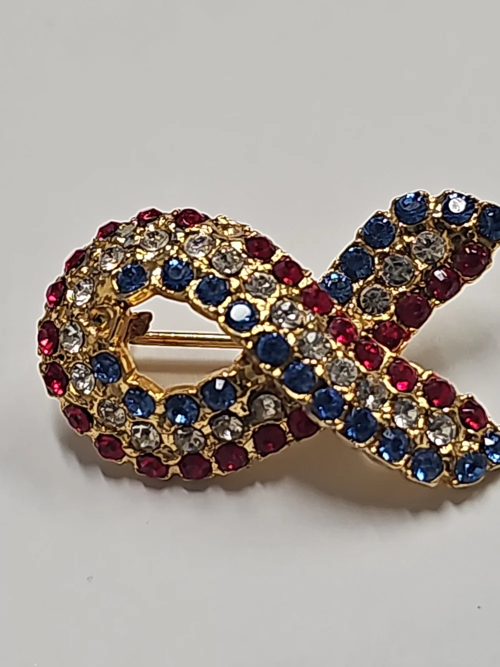 Gold-Tone Ribbon Crystal Brooch in Red, Blue, and Clear Cancer Awareness Pin